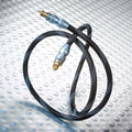 Optical Toslink cable with black braided jacket and gold connectors, straight view