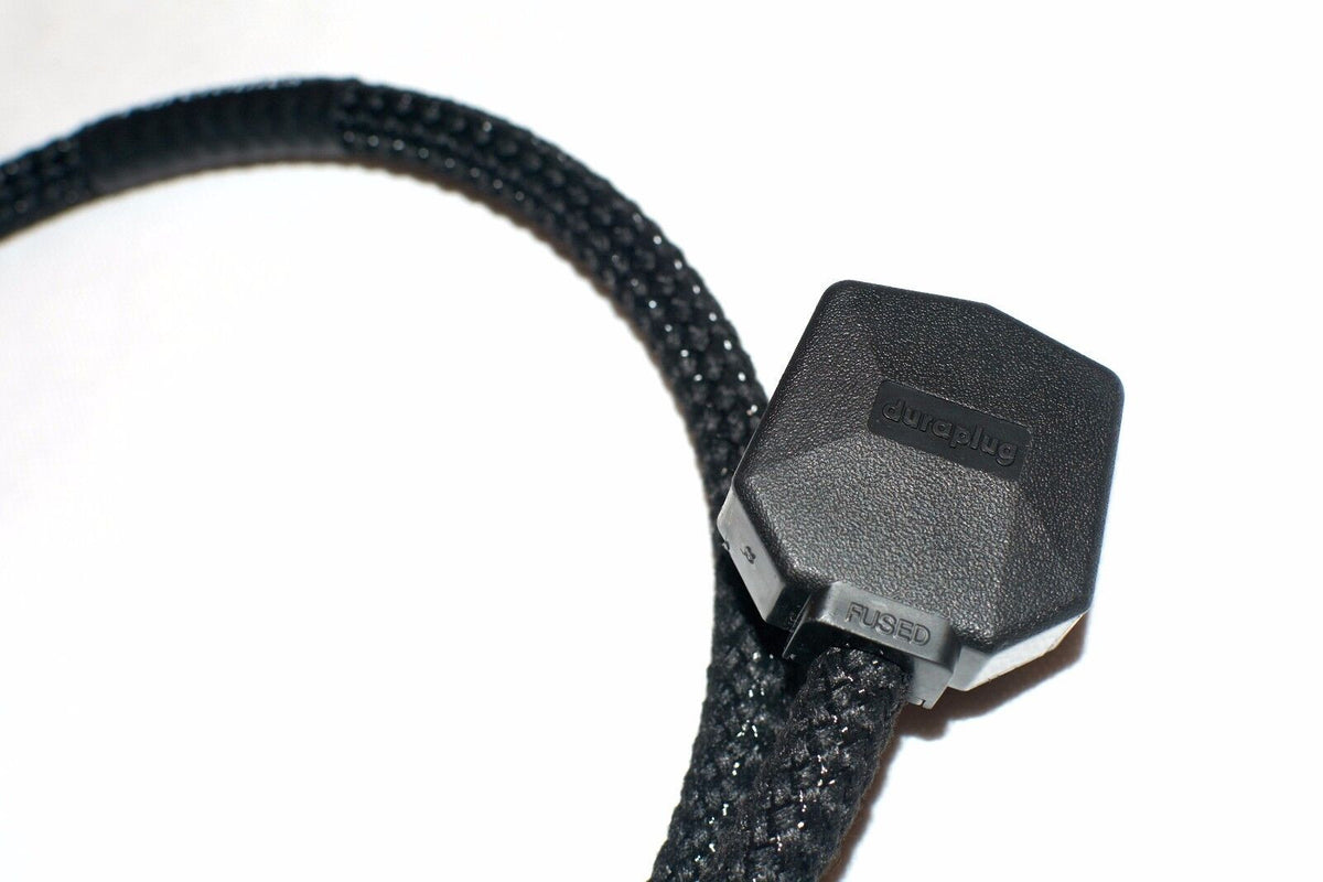 Black braided cable with dark connector housing and labeled ports