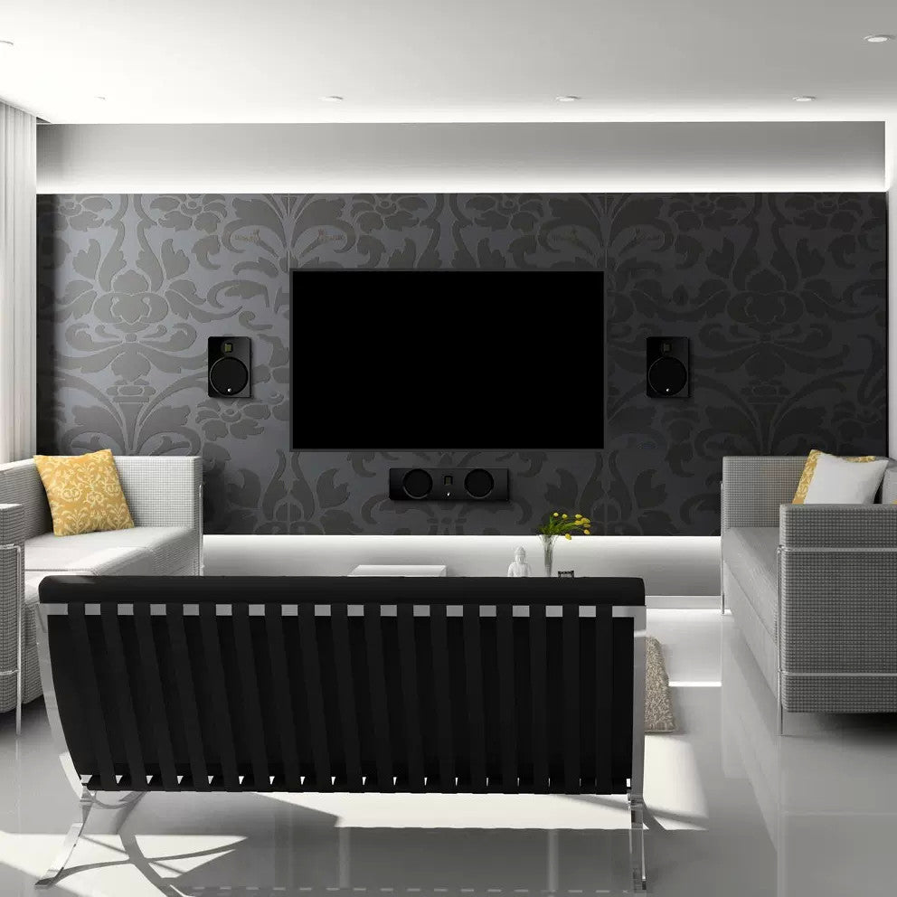 Wall-mounted charging panel in a living room, black with circular power area
