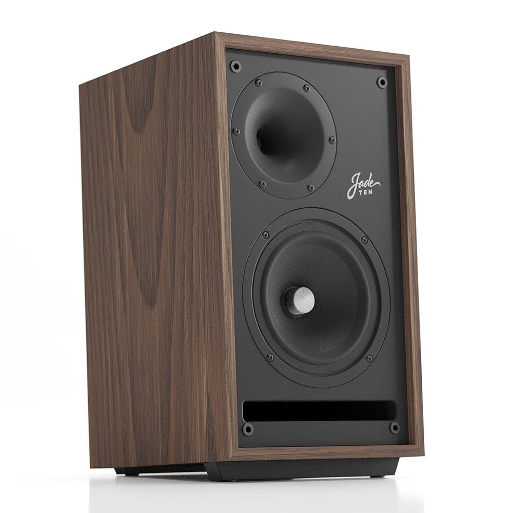 Walnut wood bookshelf speaker front close-up with two black drivers and port plate