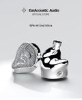 Silver glitter in-ear audio earbuds with round speaker grills and metal stems