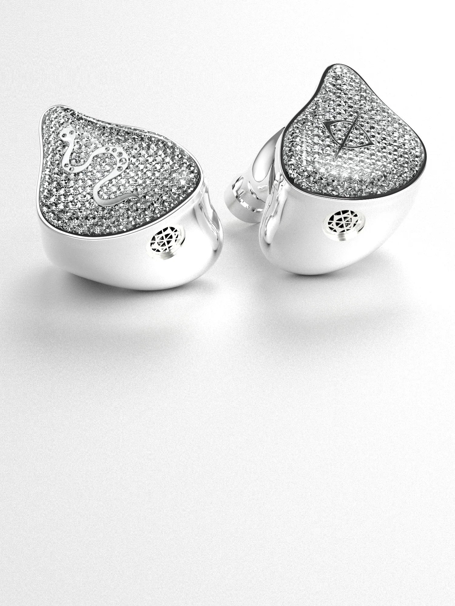 Two silver glitter in-ear audio earbuds with triangular crystal speaker faces