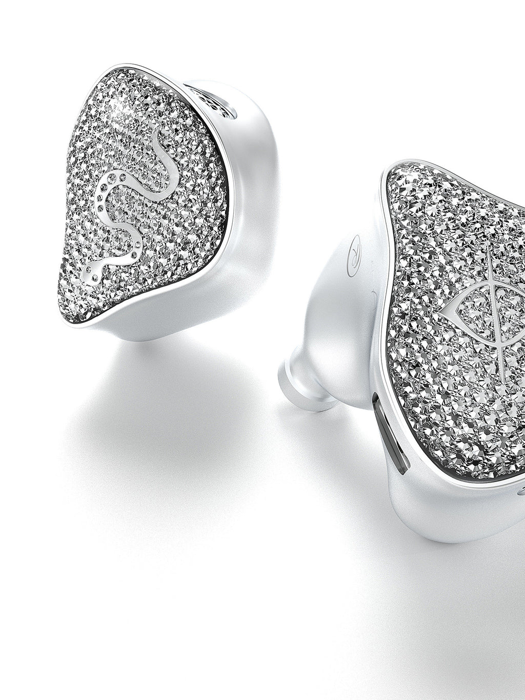 Two silver-tone earbuds with heart-shaped crystal glitter faces and smooth white tips
