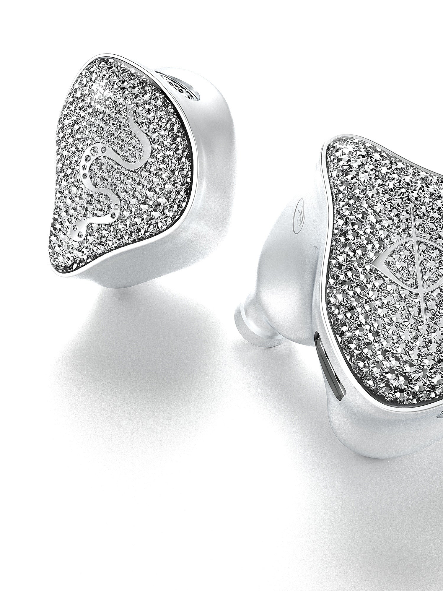 Two silver-tone earbuds with heart-shaped crystal glitter faces and smooth white tips