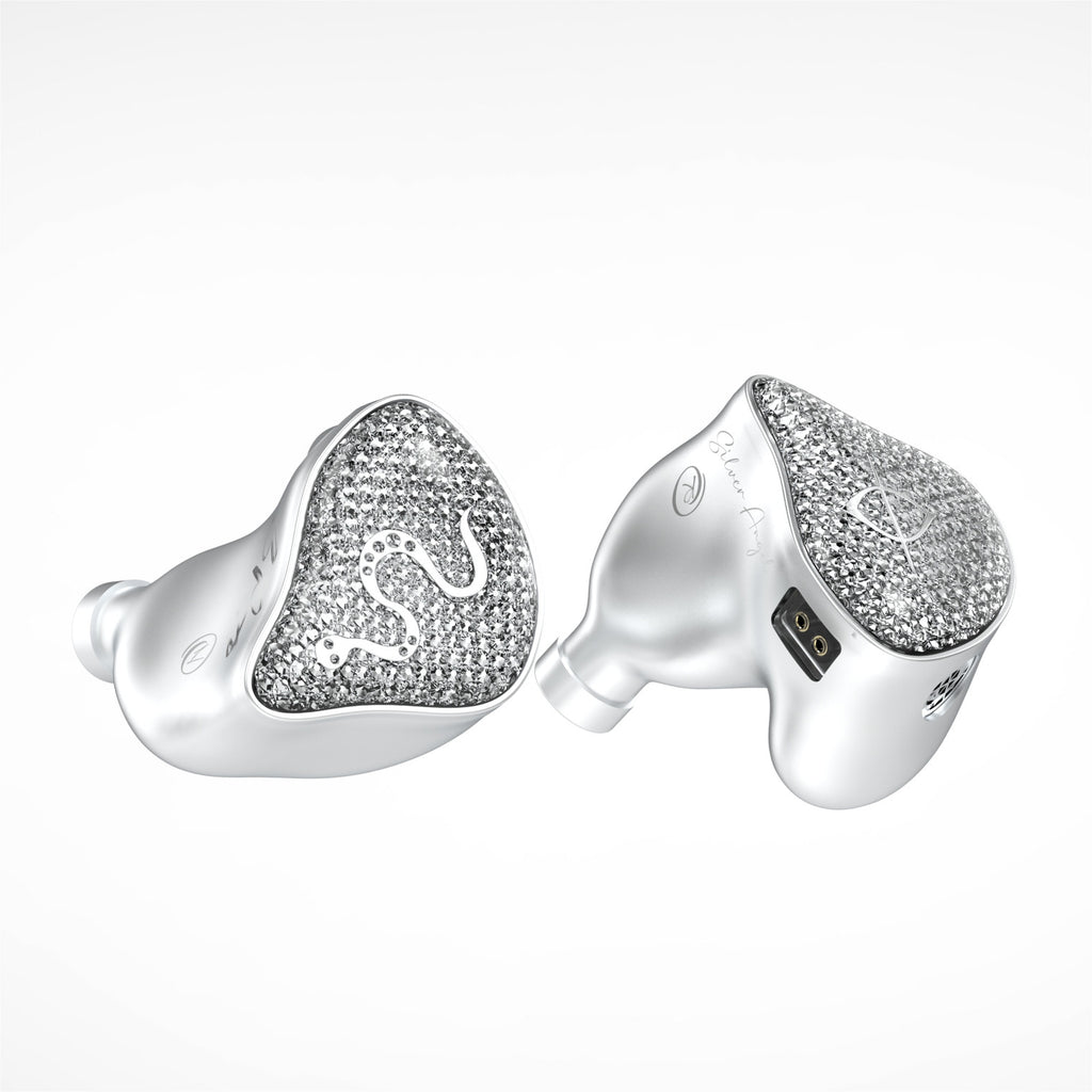Silver-tone wireless earbuds with heart-shaped glitter face and white silicone tips