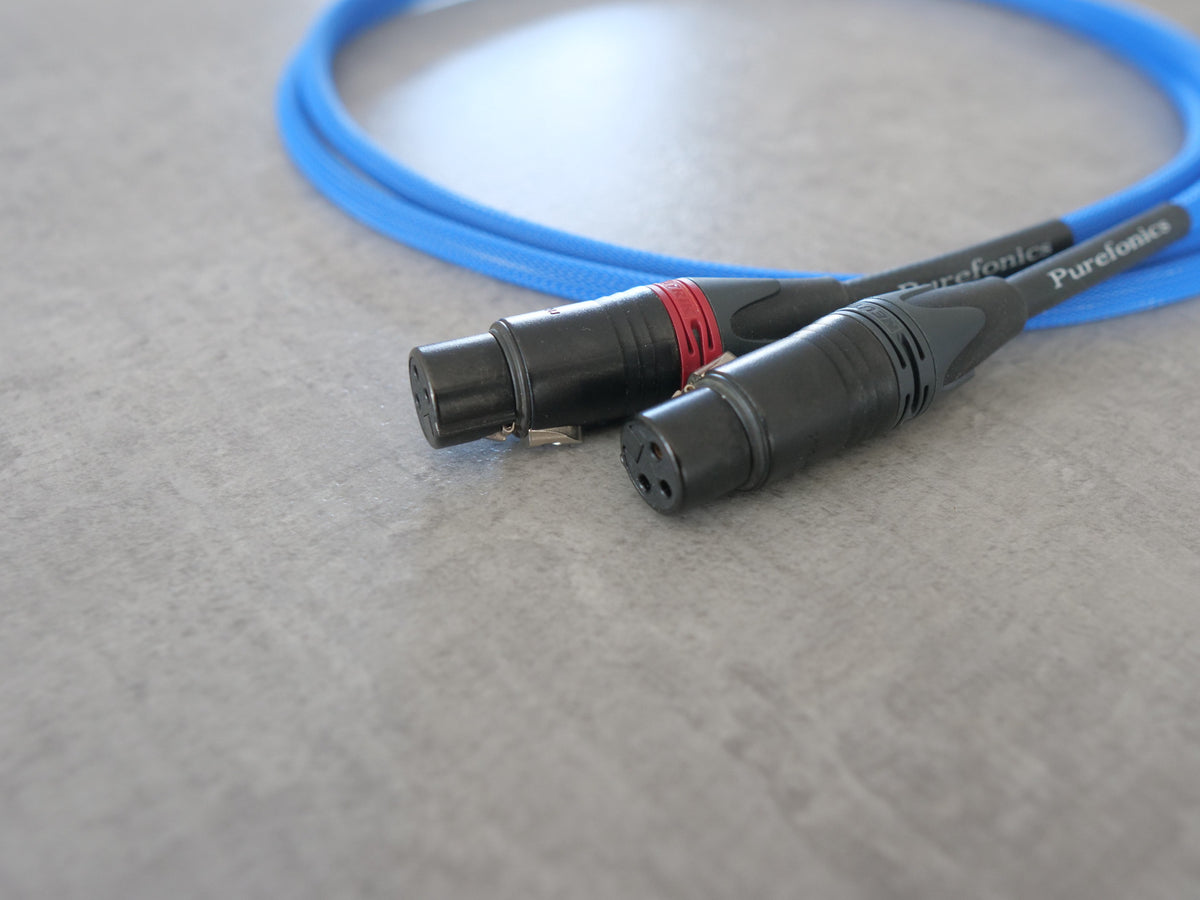 Blue XLR audio cable with two black connectors, red accents on cable ends