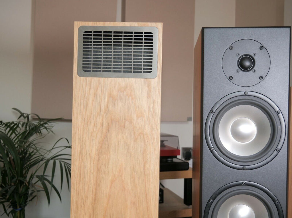 Wood-finish floor-standing speaker with vented top grille and two drivers