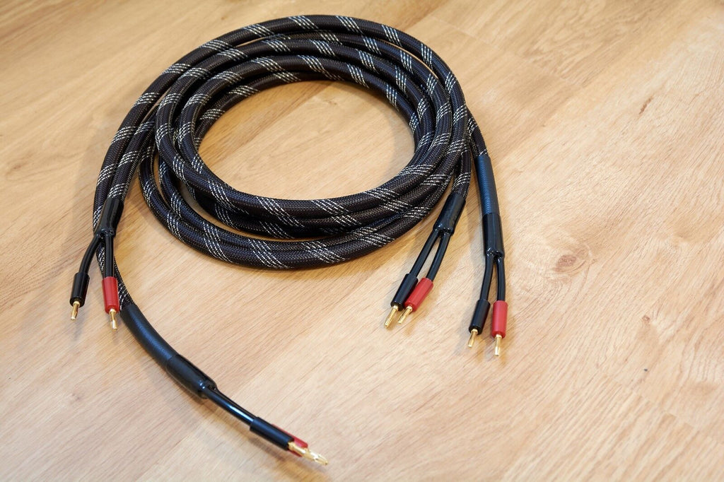 Braided audio cables with gold banana plugs, red and black connector tips