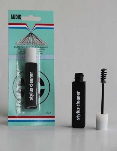 Stylus cleaning brush with black cleaner bottle and white cap