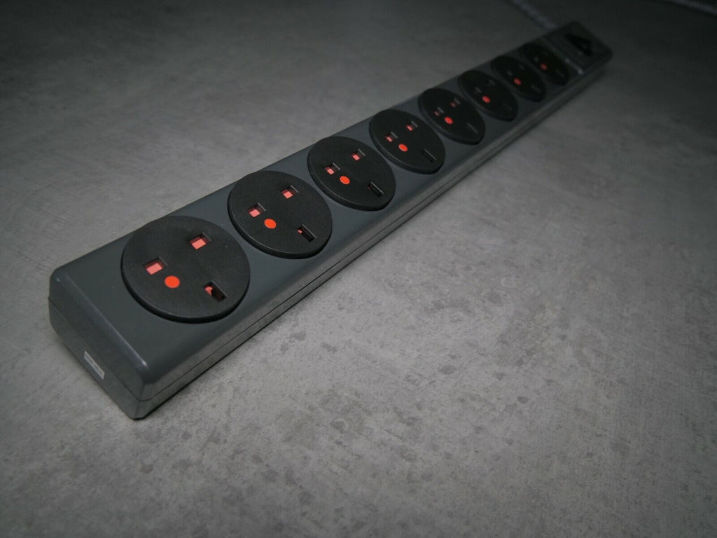 8-outlet power strip with multiple round sockets and red indicator lights