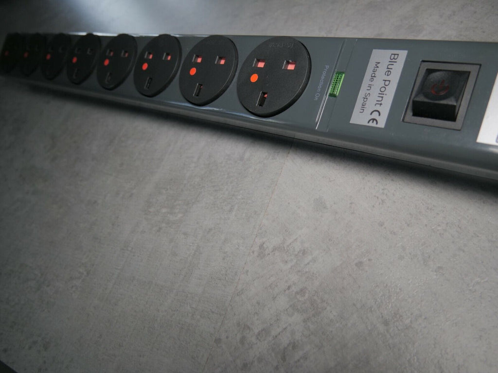 Power strip side shows multiple round outlets and a printed specification label