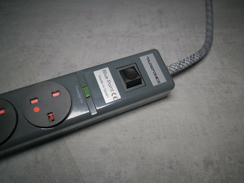 Power strip side view with AC inlet and status light near the label