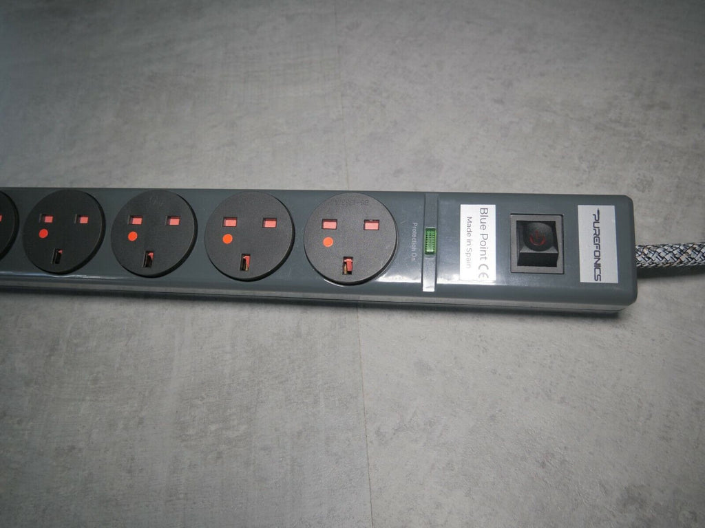 8-outlet power strip front view with indicator LEDs and safety shutters