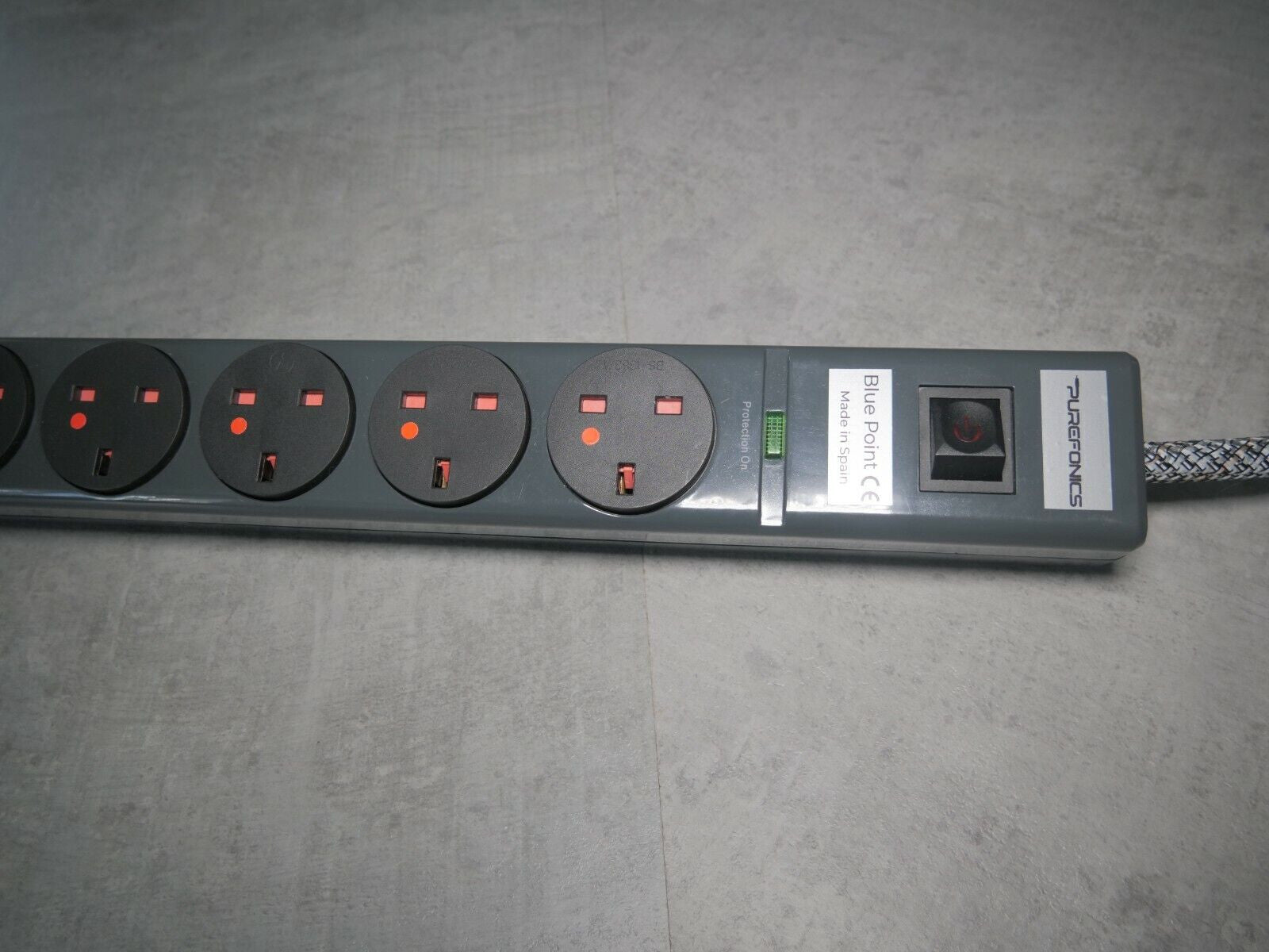 8-outlet power strip front view with indicator LEDs and safety shutters