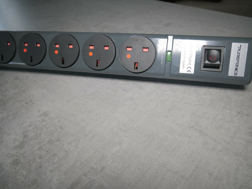 8-outlet power strip angled view with red indicator lights and front label