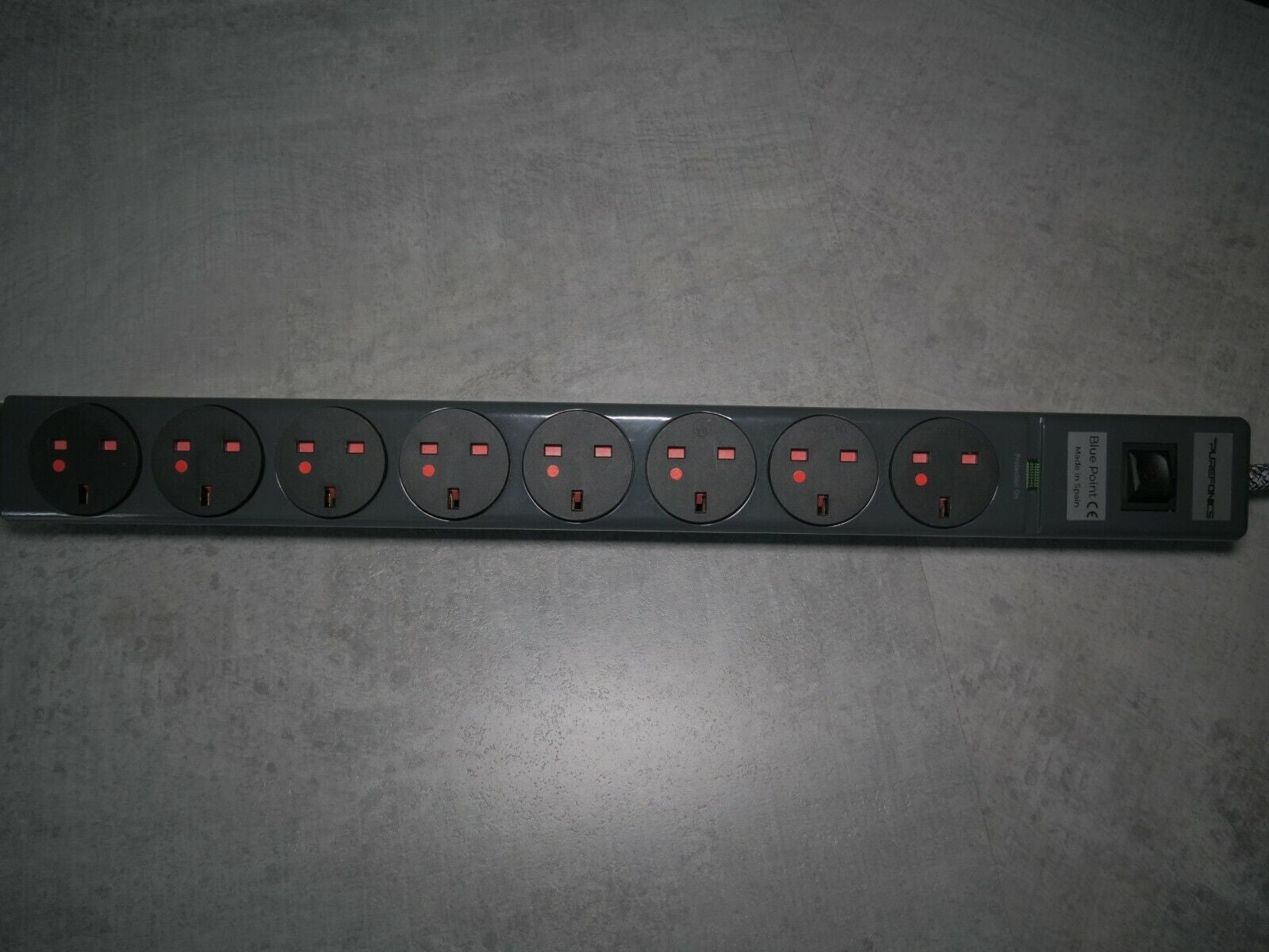 8-outlet power strip with round sockets and red indicator lights