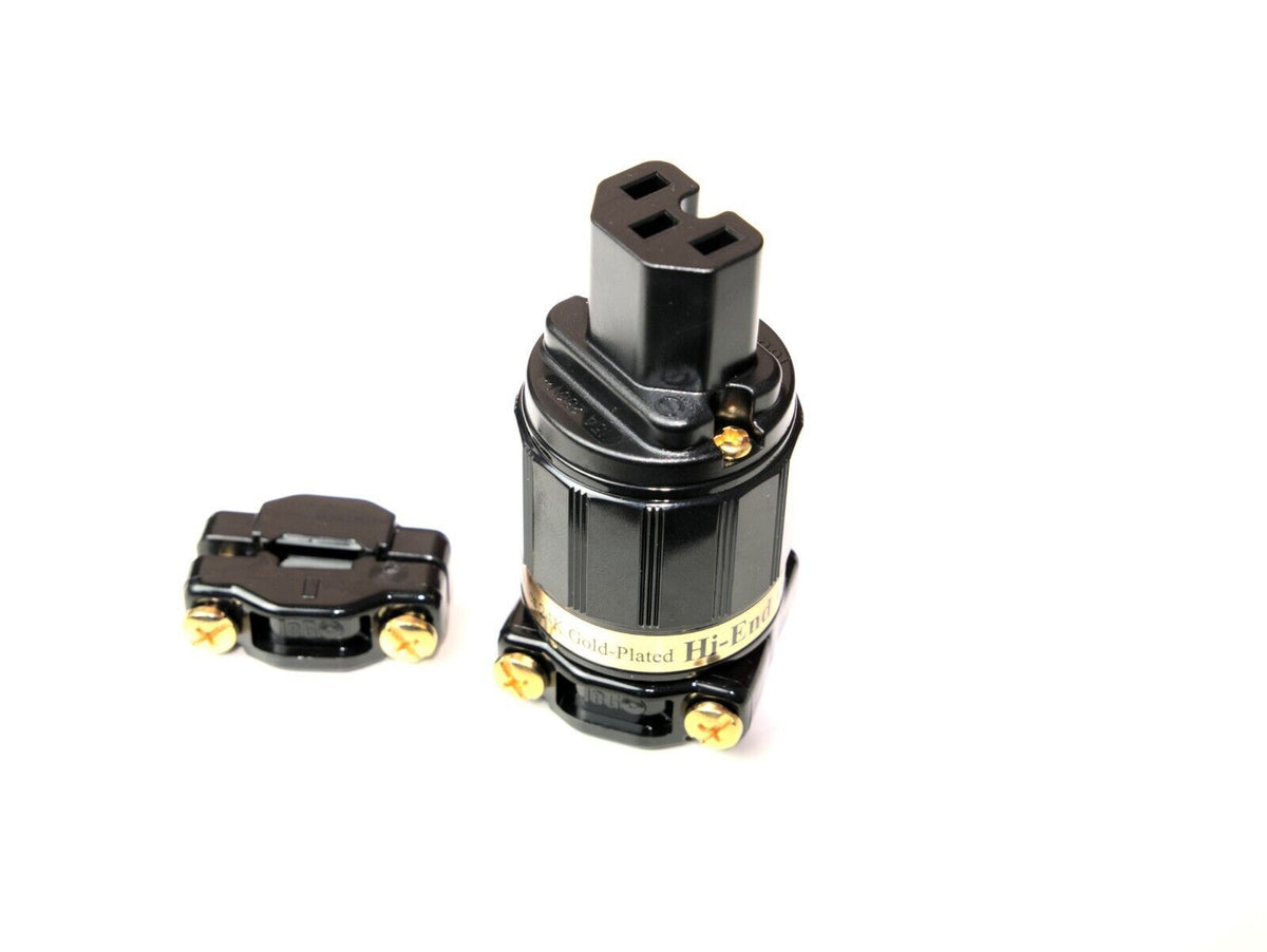 Black and silver power plug adapter with three-prong socket and metal base