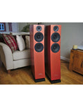 Orange bookshelf speaker tower with three black drivers and front tweeter