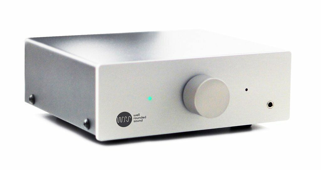 Silver stereo amplifier with front volume knob and small headphone output