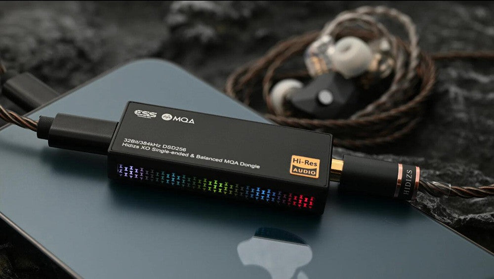 Black USB audio dongle with LED indicator bar and attached cable