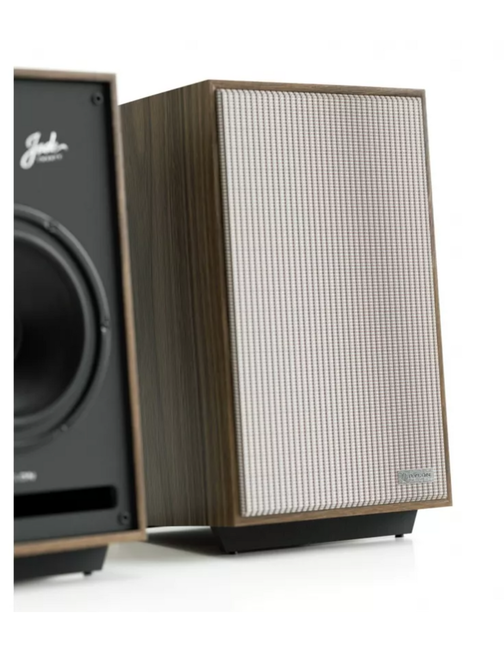 Wooden studio speaker with front grille, woofer and tweeter visible through mesh