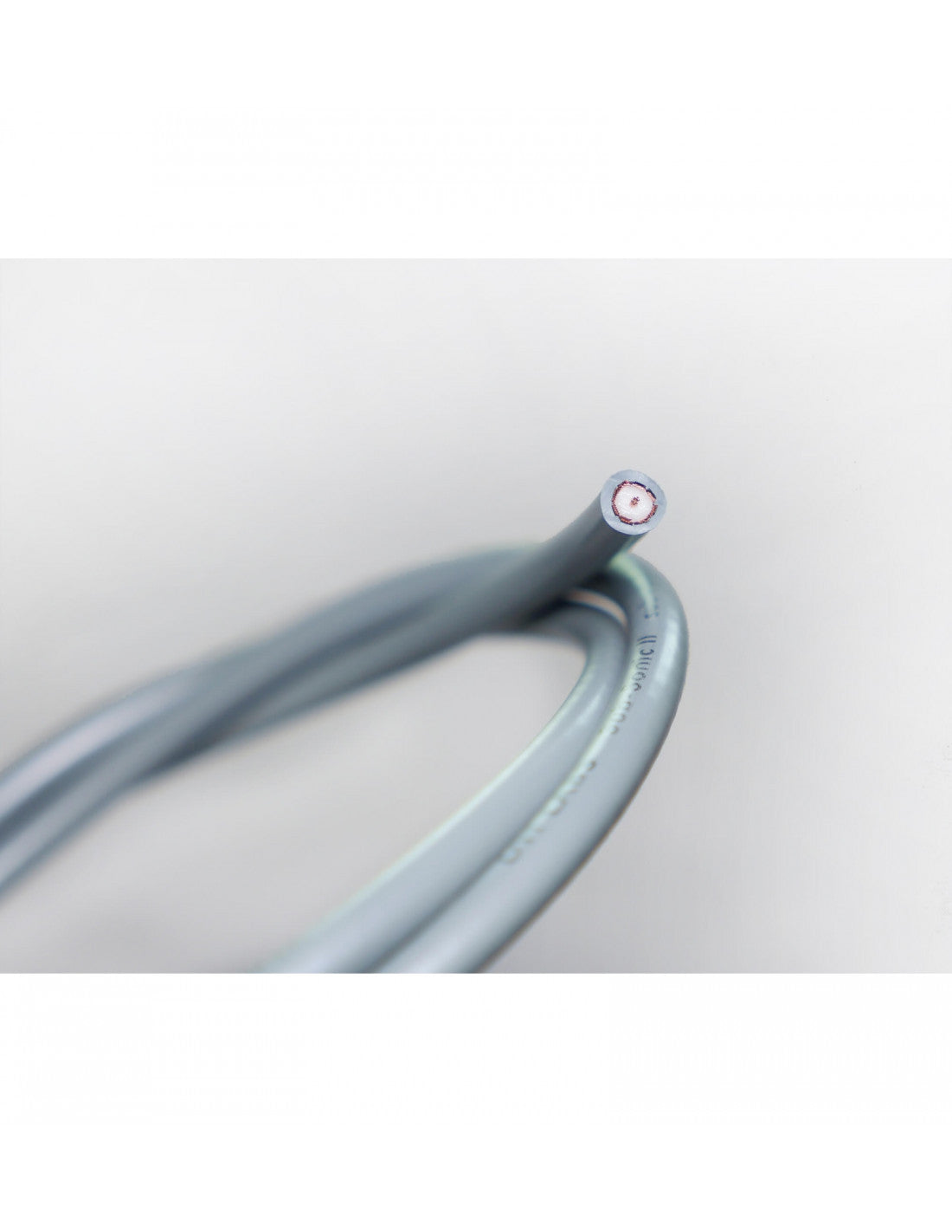 Gray-blue audio cable with red-and-white circular connector end