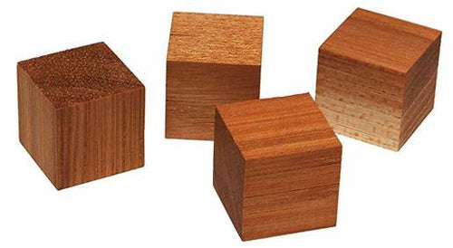 Set of four square wooden blocks with textured tops and smooth sides