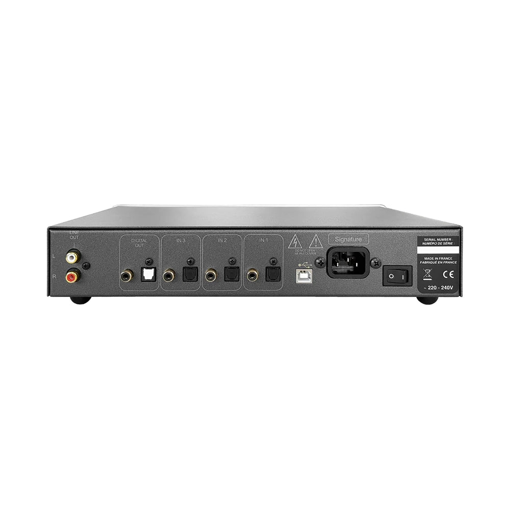 The rear panel of a black Atoll DAC100 Signature audio DAC, showing various input and output jacks, power socket, and labels including 'Stereo 2.0 Surround' and '20V 240V'