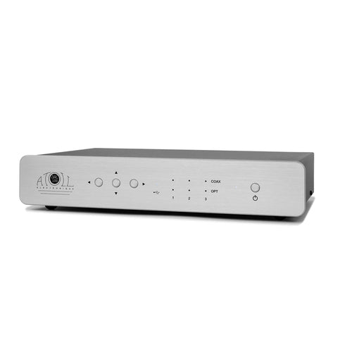 A silver Atoll DAC100 DAC electronic device,  with a brushed aluminum front panel, control buttons, and a power button, shown on a plain white background.