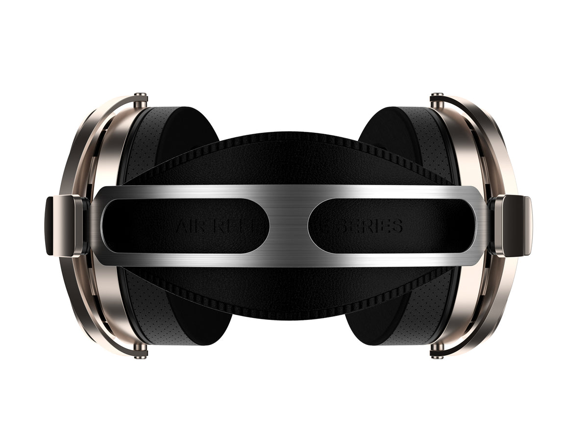 The rear view of aune ar5000 MKII over-ear headphones on a solid white background, featuring black ear cushions, a brushed silver metal headband, and silver side frames.