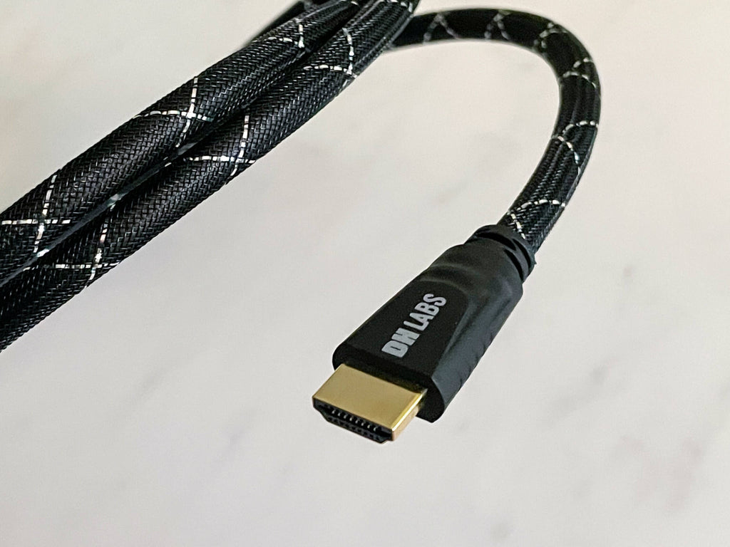 HDMI 2.1 cable with gold HDMI plug and black braided cord with light gray pattern