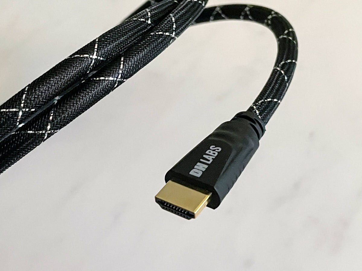 HDMI 2.1 cable with gold HDMI plug and black braided cord with light gray pattern