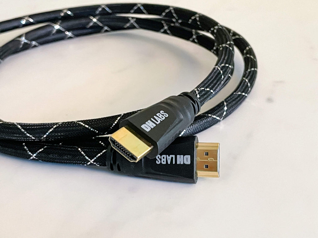 HDMI 2.1 cable with two gold HDMI connectors and black braided jacket with white lines
