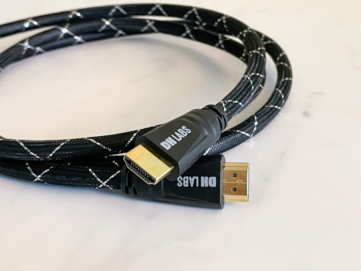 HDMI 2.1 cable with two gold HDMI connectors and black braided jacket with white lines