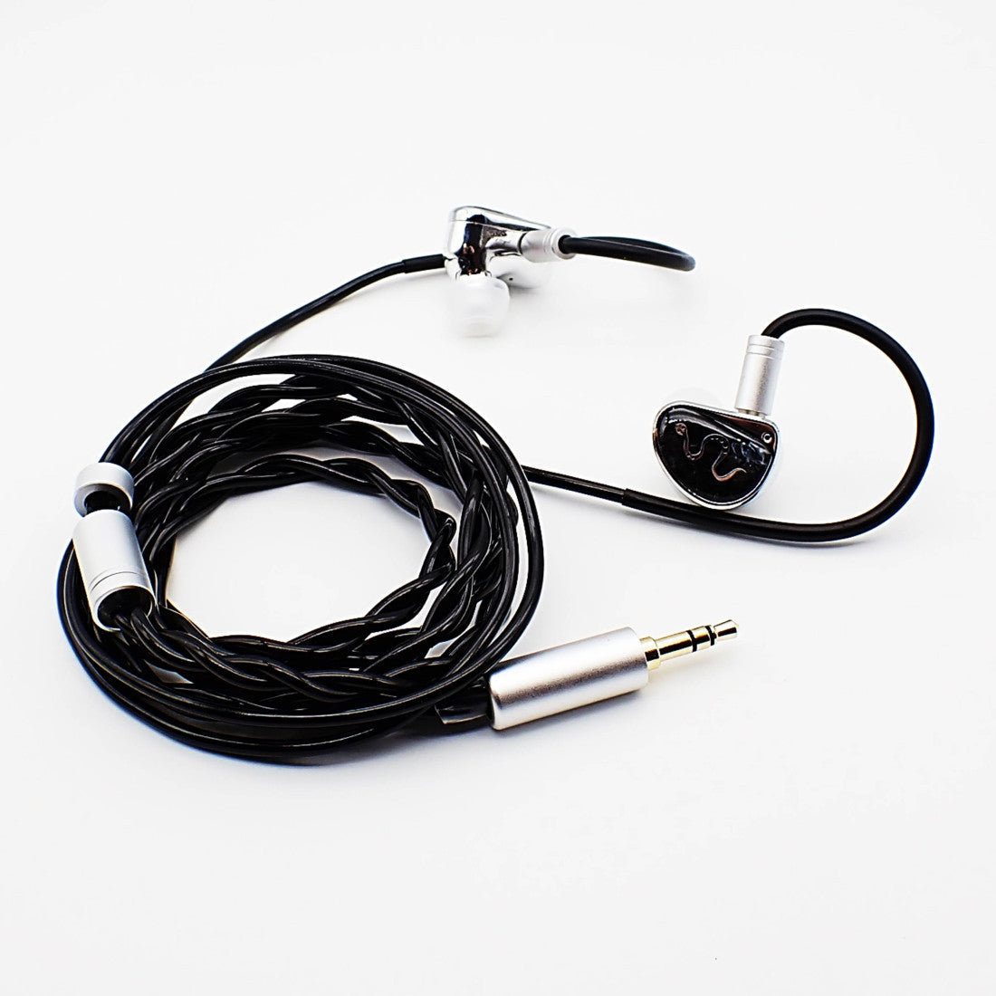 Black wired in-ear headphones with silver and gold-toned metal connectors, coiled on a white background.