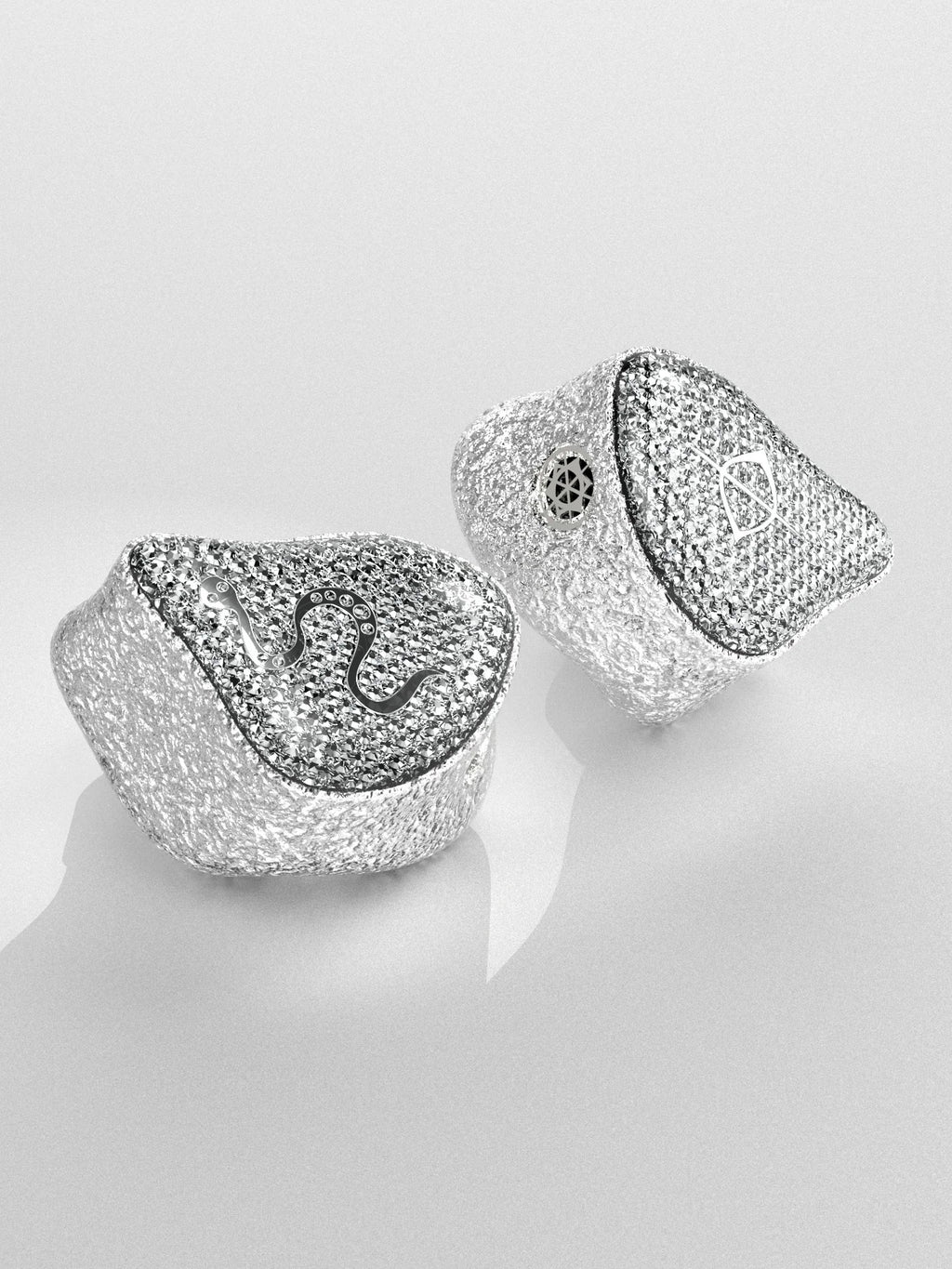 Silver in-ear monitor ear tips with mesh-style housing and built-in sound opening