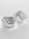 Silver in-ear monitor ear tips with mesh-style housing and built-in sound opening