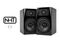 Pair of black stereo loudspeakers (NHT C-1) with dual drivers