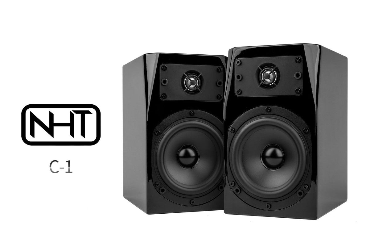 Pair of black stereo loudspeakers (NHT C-1) with dual drivers