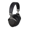 Black over-ear headphones with padded headband and metal yokes, closed earcups