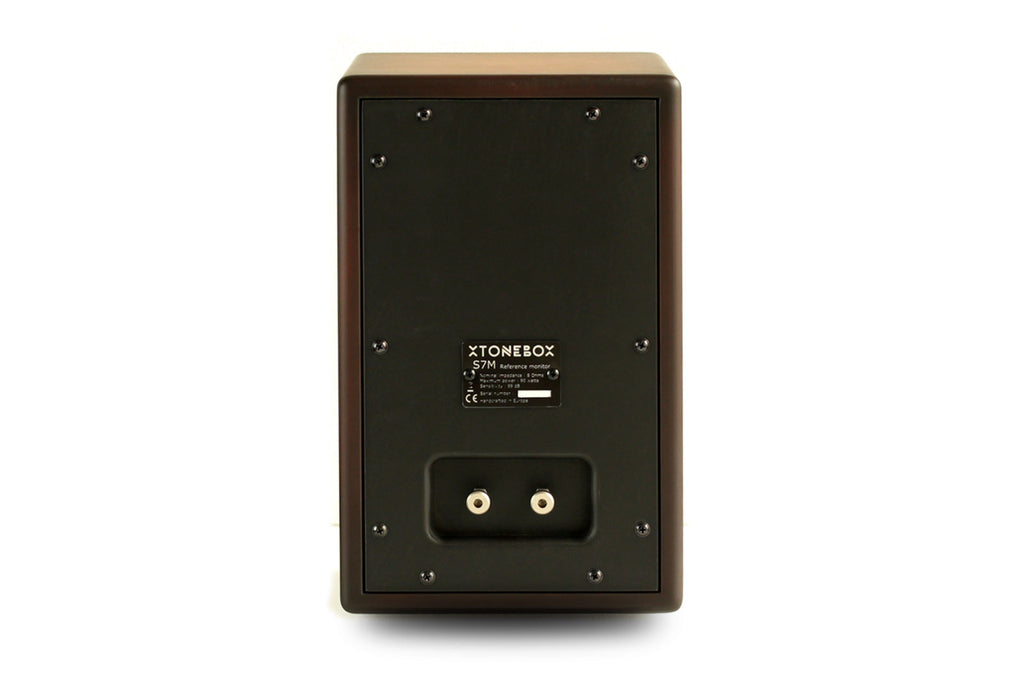 Wooden portable speaker back panel with dual RCA inputs and compliance label