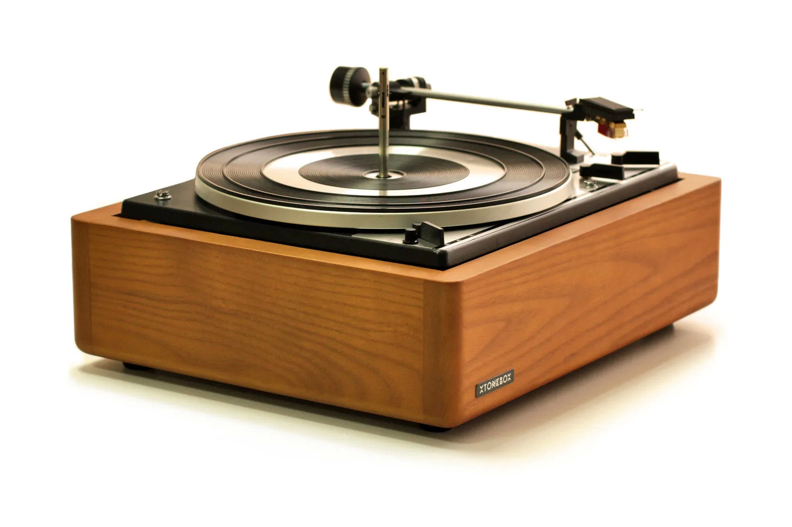 Xtonebox 121ST turntable in wood cabinet with tonearm and spinning vinyl record
