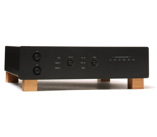 A black audio amplifier or receiver chassis with light wood legs, shown from a front three-quarter angle on a white background.
