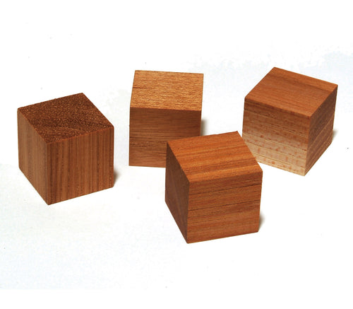 Four small wooden hickory acoustic revive blocks with visible wood grain in different warm brown tones, arranged on a plain white background.