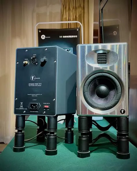 Active bookshelf loudspeaker with rear input panel and woofer, side view