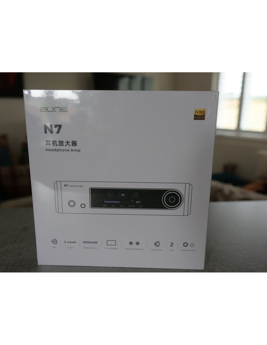 White box for aune N7D headphone amplifier with onboard DAC, front panel ports illustration