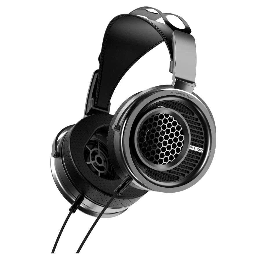 A pair of over-ear wired headphones with a black and silver metallic finish, shown from a three-quarters angle on a solid white background.