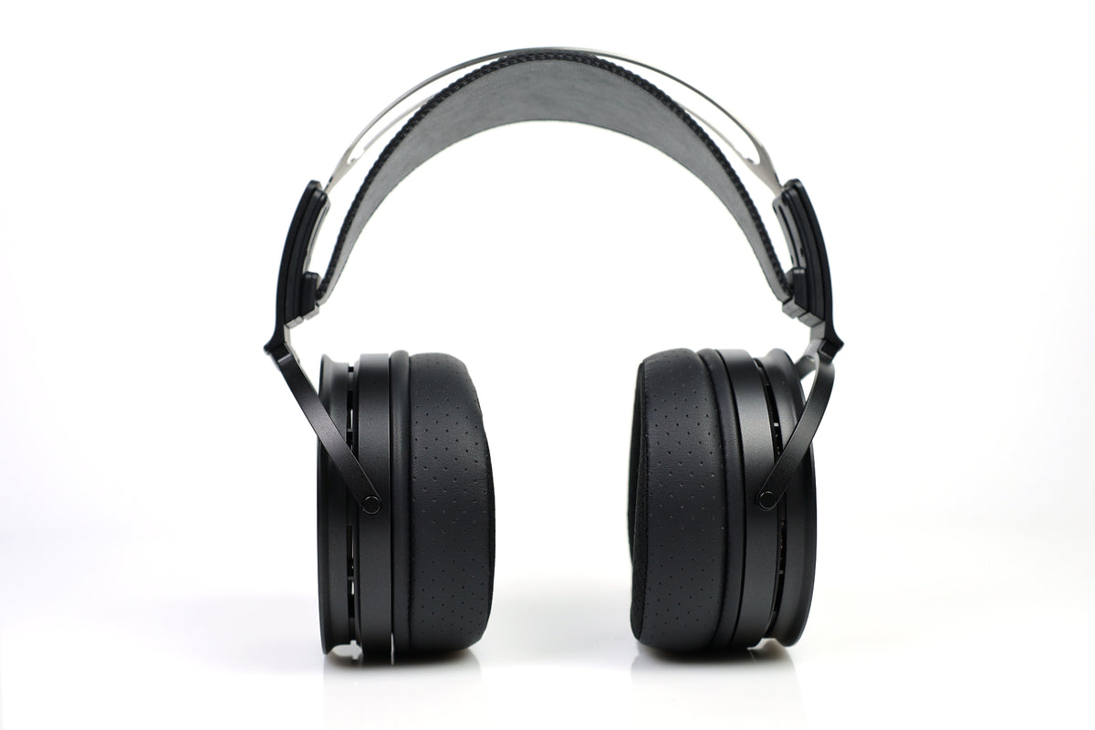 Black aune ar3000 over-ear headphones with a padded headband and circular ear cups, photographed from the side against a clean white background.