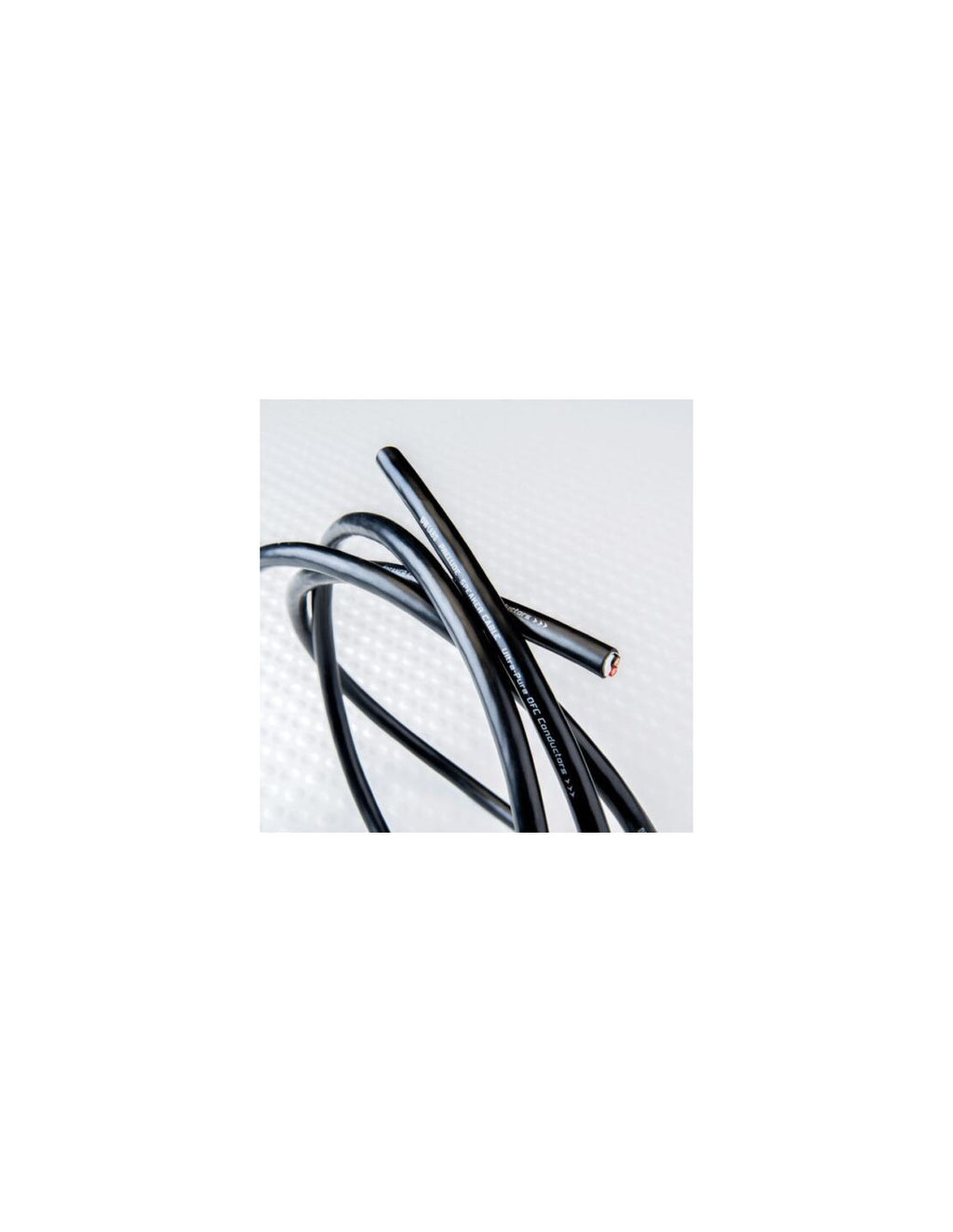 Black speaker cable ends with metal connector tips