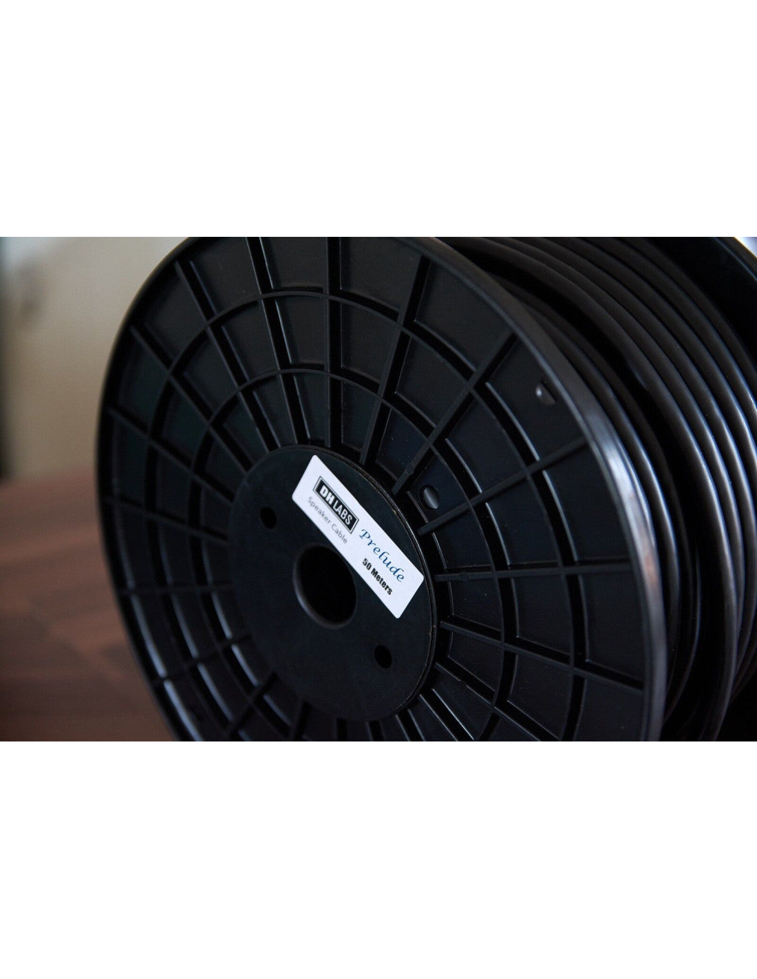 Black speaker cable spool with label center detail